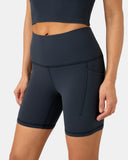Pantalones cortos de yoga Dreamlux de cintura alta de 6" con bolsillos