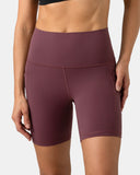 Pantalones cortos de yoga Dreamlux de cintura alta de 6" con bolsillos