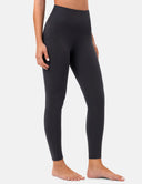 Black leggings worn by a person on a white background
