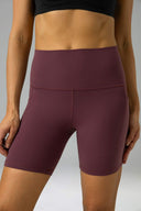 Pantalones cortos de yoga Dreamlux de cintura alta de 6" con bolsillos