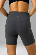 Pantalones cortos de yoga Dreamlux de cintura alta de 6" con bolsillos
