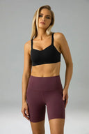 Pantalones cortos de yoga Dreamlux de cintura alta de 6" con bolsillos