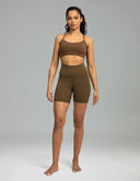 Pantalones cortos de yoga Dreamlux de cintura alta de 6" con bolsillos
