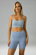 Pantalones cortos de yoga Dreamlux de cintura alta de 6" con bolsillos