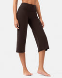 Woman wearing high-waisted brown cropped yoga pants for activewear.