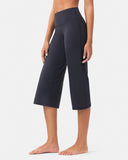 Woman wearing high-waisted black cropped yoga pants for activewear.