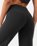 Close-up of women's high waisted black activewear leggings showing the back seam and fit.