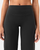 Close-up of women's high waisted black yoga pants with a smooth, seamless fit.